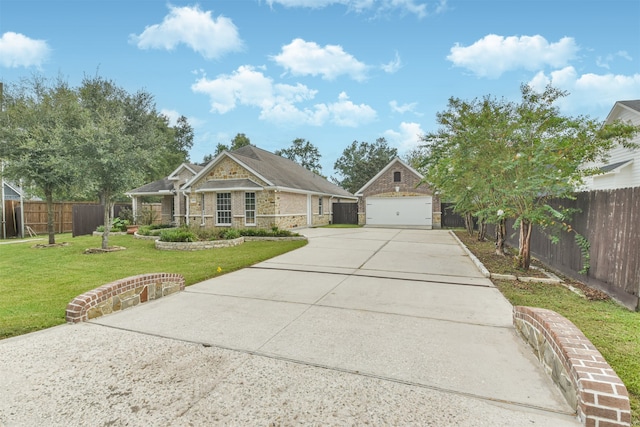 view of front of property with a front yard and a garage