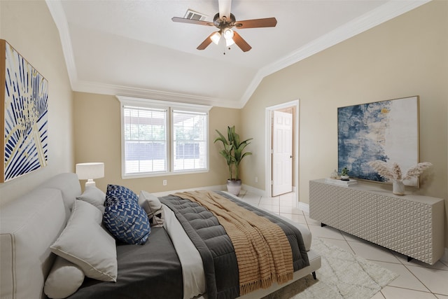 tiled bedroom featuring ornamental molding, vaulted ceiling, and ceiling fan