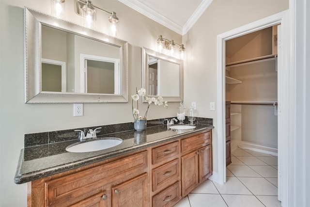 bathroom featuring crown molding, lofted ceiling, vanity, and tile patterned floors