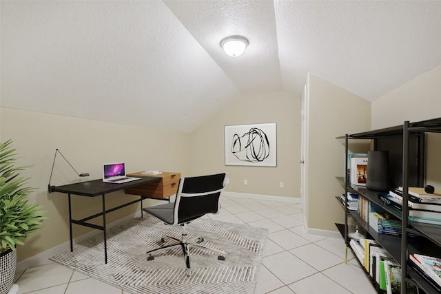 tiled home office with a textured ceiling and lofted ceiling