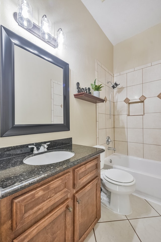 full bathroom with tiled shower / bath, vanity, tile patterned flooring, and toilet