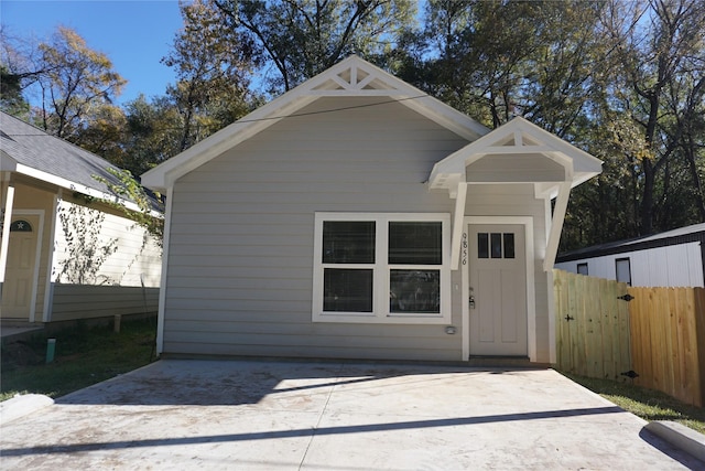 exterior space featuring an outbuilding and fence