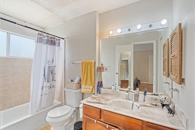 full bathroom featuring shower / tub combo with curtain, vanity, and toilet