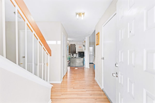 hall featuring light hardwood / wood-style flooring