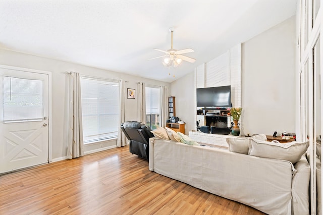 living room with ceiling fan and light hardwood / wood-style floors