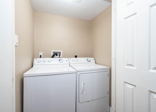 laundry room featuring washer and dryer and laundry area