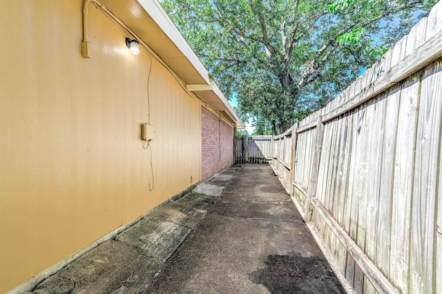 view of side of property featuring fence