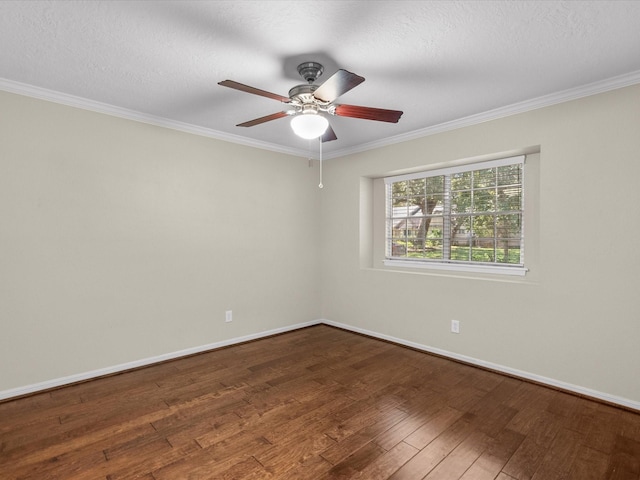 empty room featuring ceiling fan, hardwood / wood-style floors, a textured ceiling, and ornamental molding