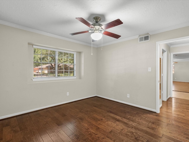 spare room with a textured ceiling, ceiling fan, ornamental molding, and dark wood-type flooring