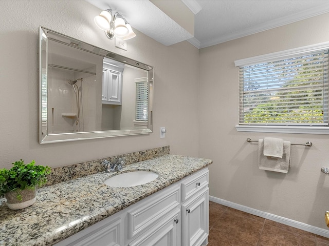 bathroom with tile patterned flooring, vanity, walk in shower, and crown molding