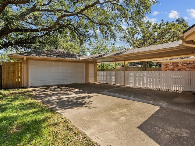 view of parking with a garage