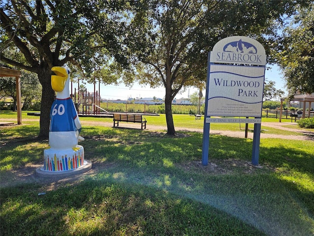 surrounding community with a yard and a playground