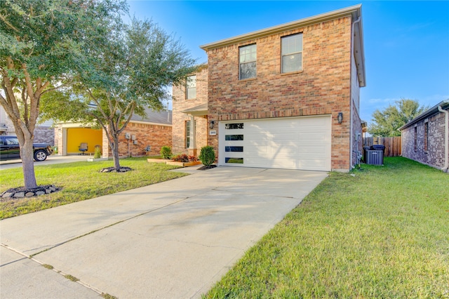 front facade with a garage, cooling unit, and a front yard