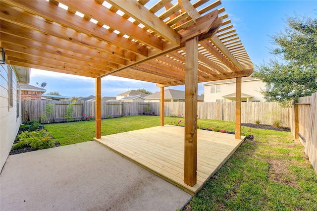 wooden terrace with a pergola, a lawn, and a patio