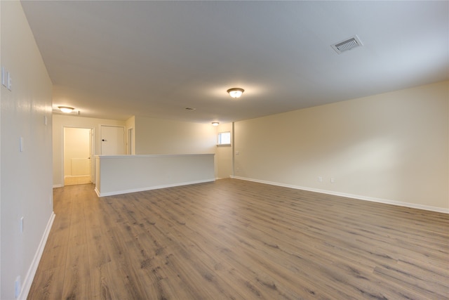 unfurnished room featuring wood-type flooring