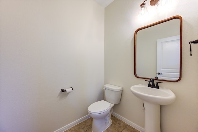 bathroom with tile patterned floors and toilet