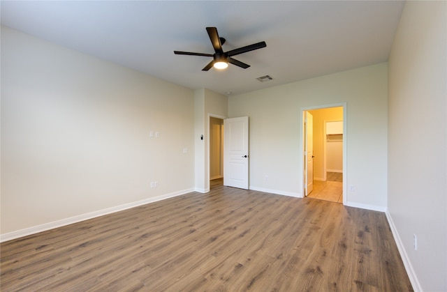 unfurnished bedroom featuring light hardwood / wood-style flooring and ceiling fan