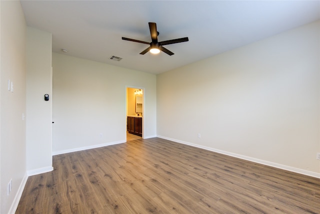 unfurnished room with hardwood / wood-style flooring and ceiling fan