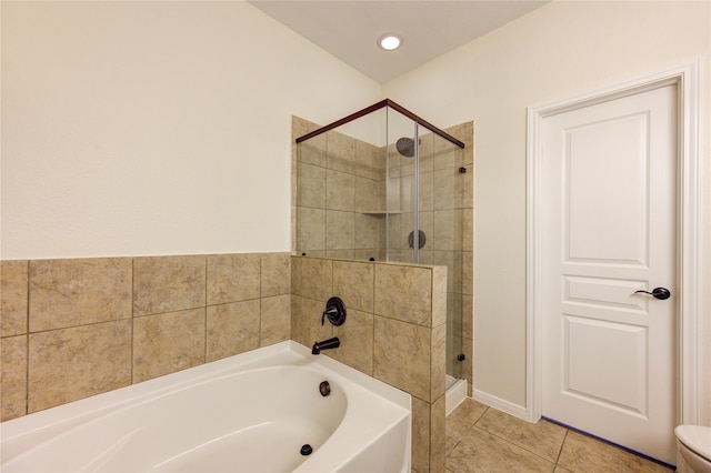 bathroom featuring plus walk in shower and tile patterned flooring