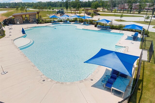 view of swimming pool with a patio area