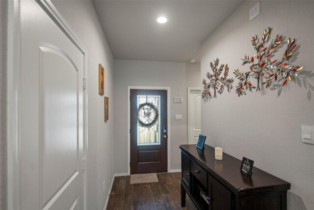 entryway with dark hardwood / wood-style flooring