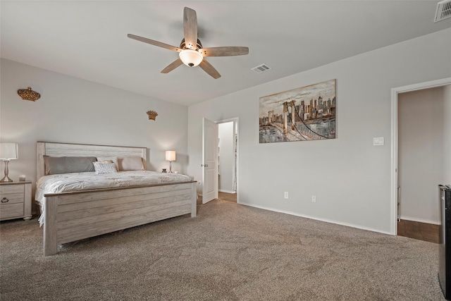 bedroom featuring dark carpet and ceiling fan