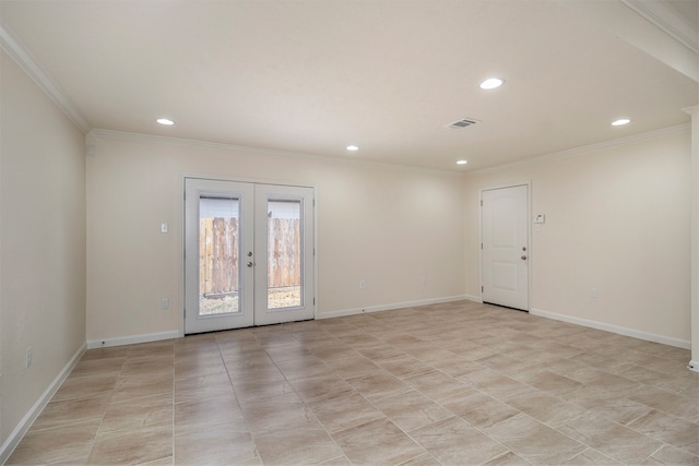 empty room with ornamental molding and french doors