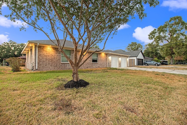 single story home with a garage and a front yard