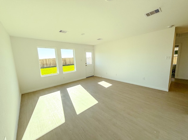 spare room with light hardwood / wood-style floors