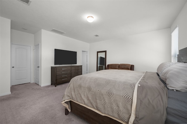 bedroom with light colored carpet