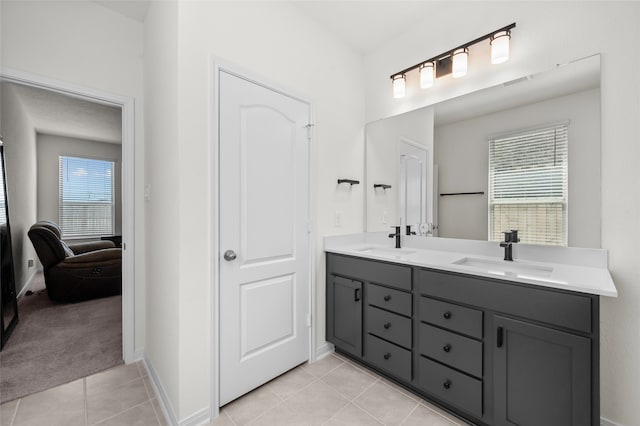 bathroom featuring tile patterned flooring and vanity