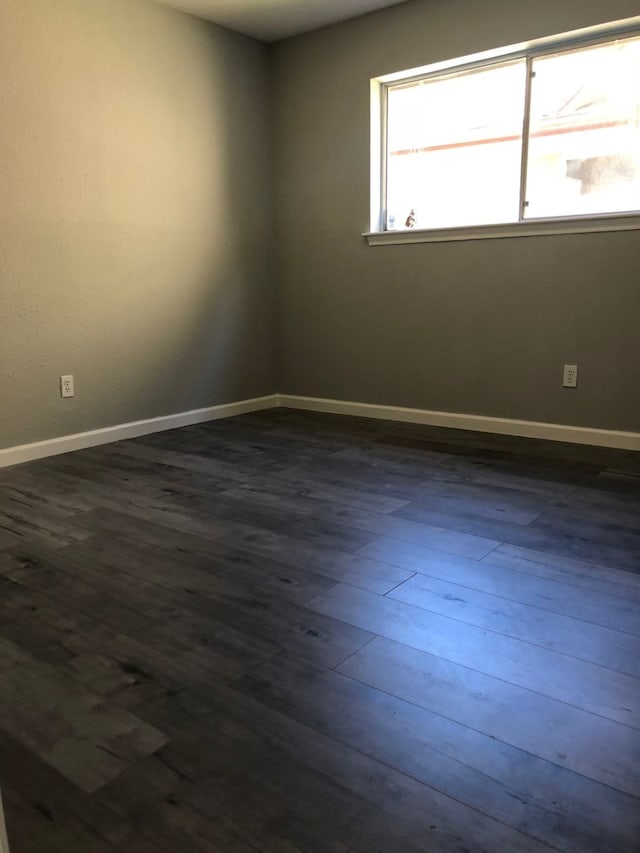 empty room featuring dark hardwood / wood-style floors