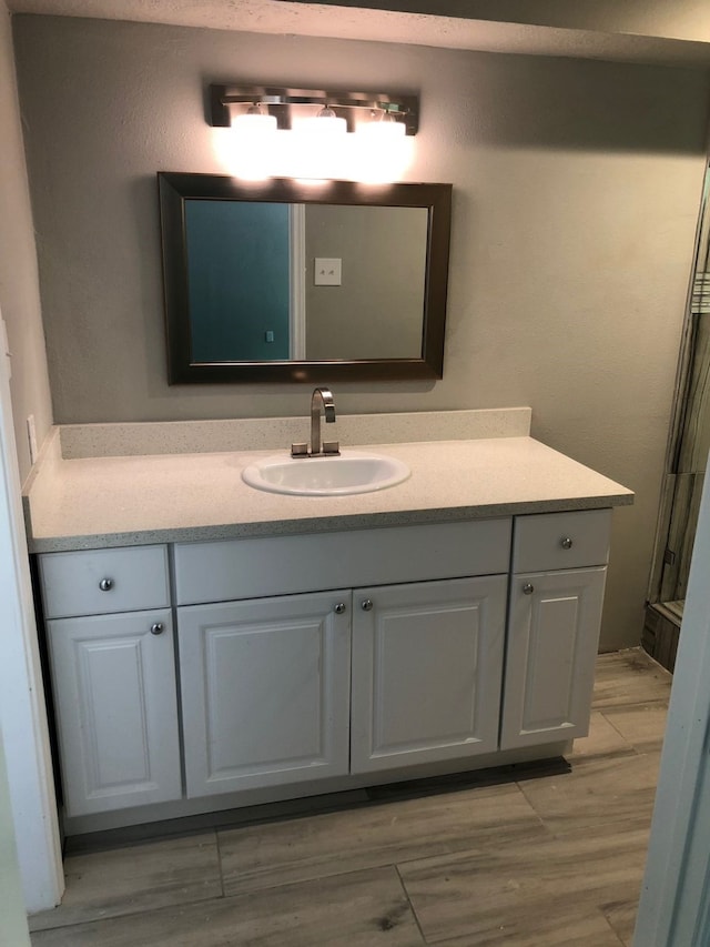 bathroom featuring hardwood / wood-style floors and vanity