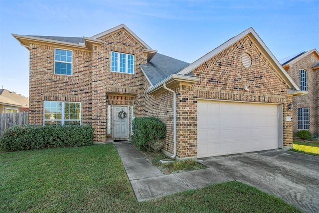 front facade featuring a front yard and a garage