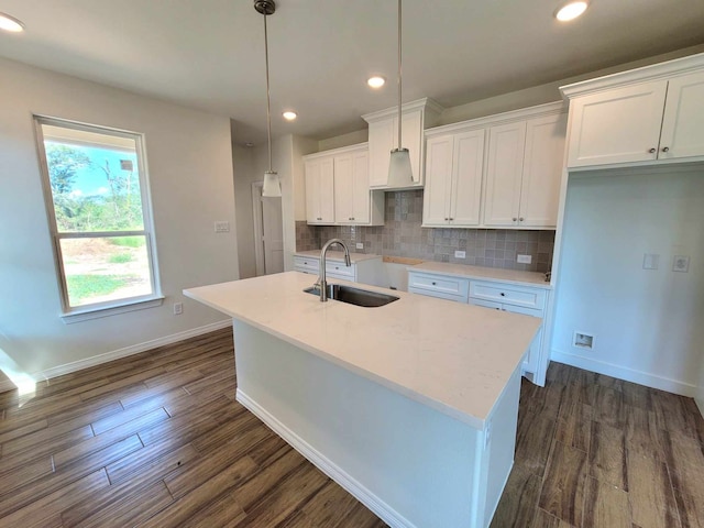 kitchen with white cabinetry, sink, and dark hardwood / wood-style flooring