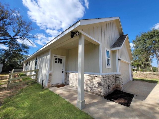 view of exterior entry with a garage