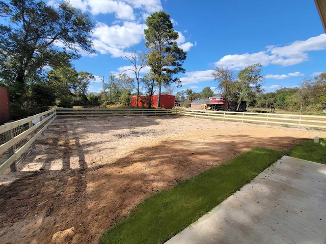 24644 Cavan St, Hempstead, TX 77445 - view of yard featuring a view of rural / pastoral area, fence, an outdoor riding arena, and an outdoor structure