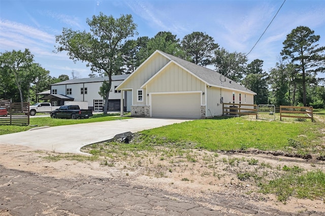 24644 Cavan St, Hempstead, TX 77445 - view of front facade featuring board and batten siding, driveway, and an attached garage
