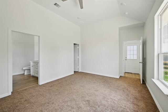 24644 Cavan St, Hempstead, TX 77445 - unfurnished bedroom with carpet floors, baseboards, connected bathroom, high vaulted ceiling, and ceiling fan