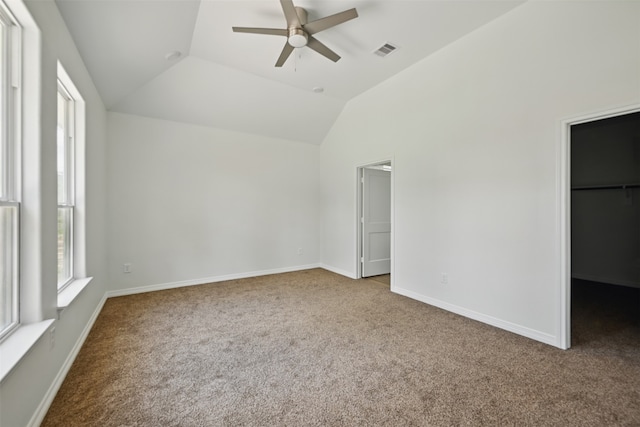 24644 Cavan St, Hempstead, TX 77445 - unfurnished bedroom featuring a walk in closet, carpet floors, vaulted ceiling, baseboards, and ceiling fan