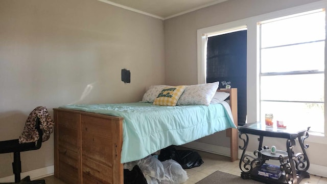 bedroom with ornamental molding