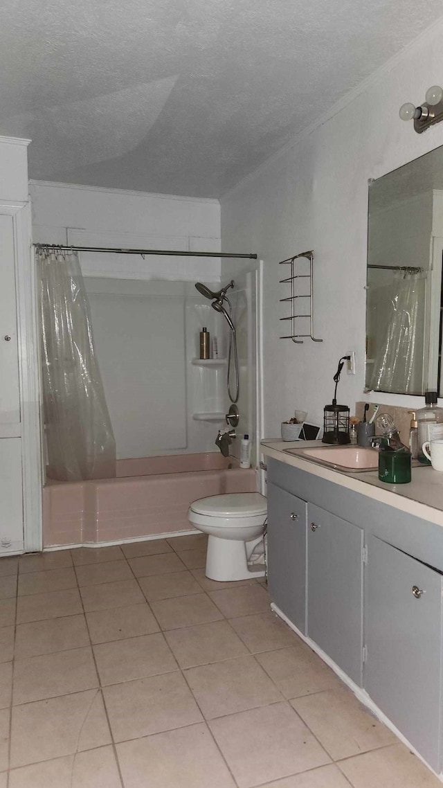 full bathroom featuring vanity, shower / bath combination with curtain, a textured ceiling, tile patterned flooring, and toilet