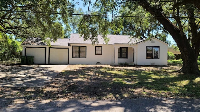 ranch-style home featuring a garage