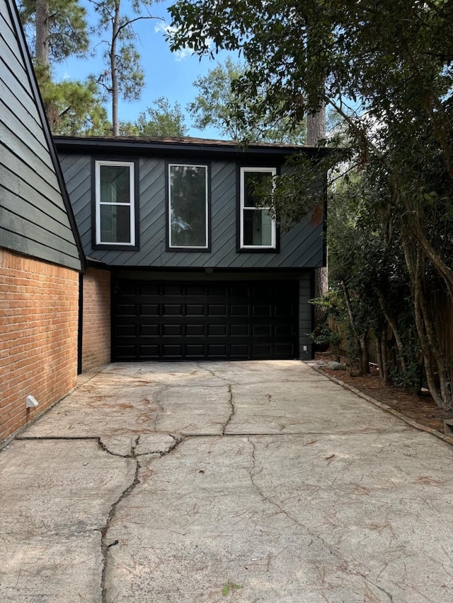 view of side of property featuring a garage