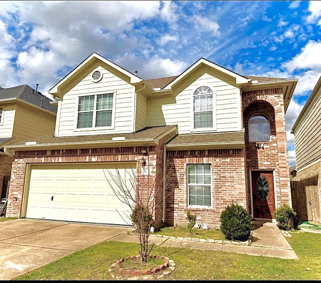 view of front of property featuring a front yard and a garage