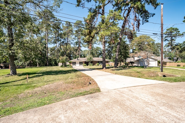 view of front of house featuring a garage and a front lawn