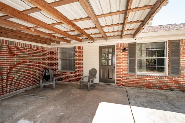 doorway to property featuring a patio