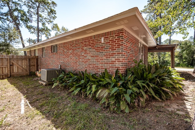 view of property exterior with central AC unit