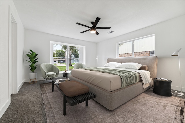 bedroom featuring ceiling fan and carpet