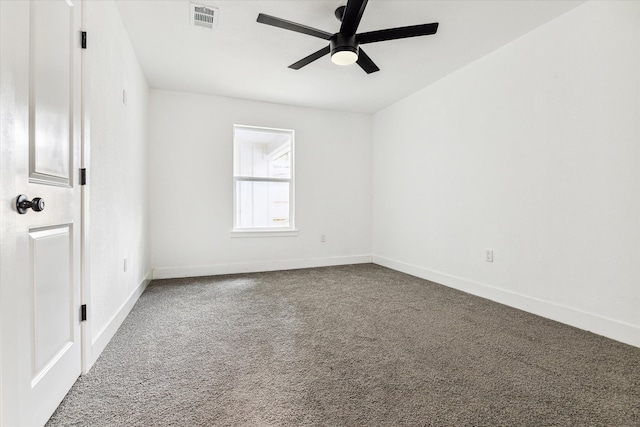 spare room featuring carpet floors and ceiling fan